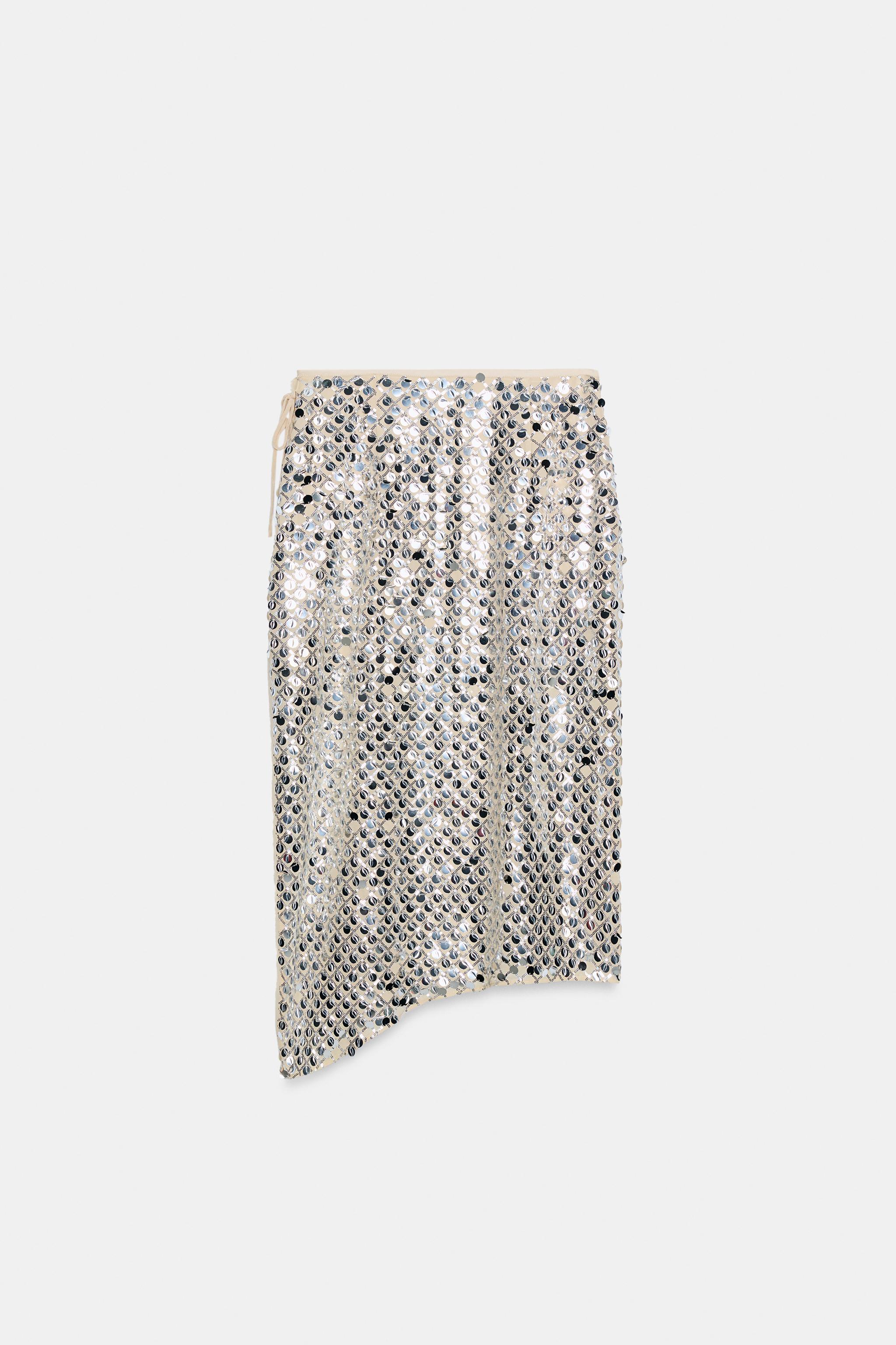 JUPE MI-LONGUE ASYMÉTRIQUE À PAILLETTES